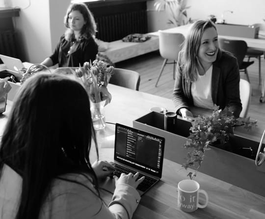 a group of colleagues sitting on a round table